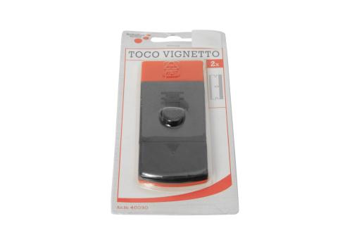 En pakke med en TOCO VIGNETTO dørstopper med grå plastikkrog på hvid og orange baggrund.
