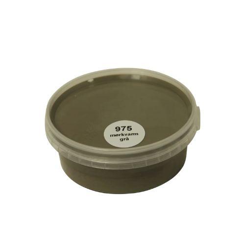 Billedet viser en rund farveprøve bøtte med maling i en ensartet, livlig og klar grå varmgrå farve. Overfladen fremstår dækkende og jævn, hvilket giver et realistisk indtryk af farvens udtryk på malede overflader. Farveprøven anvendes til at vurdere nuance, dækkeevne og finish før valg af maling til større projekter. Den grå farve repræsenterer en af de farvenuancer, som findes i udvalget af træbeskyttelse.